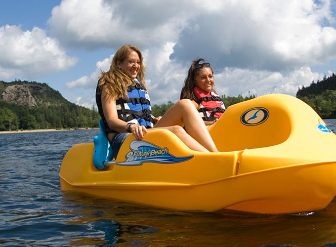 2 women in a paddle boat rental at echo lake beach