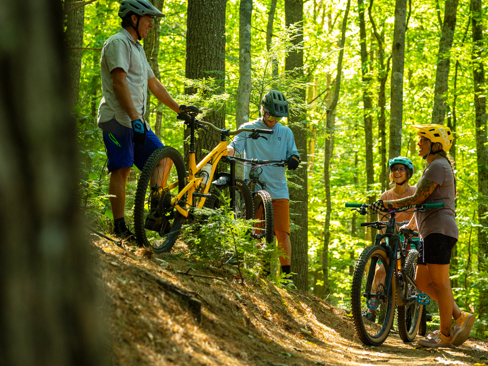 mountain bikers gathering on the trail at bear brook state park