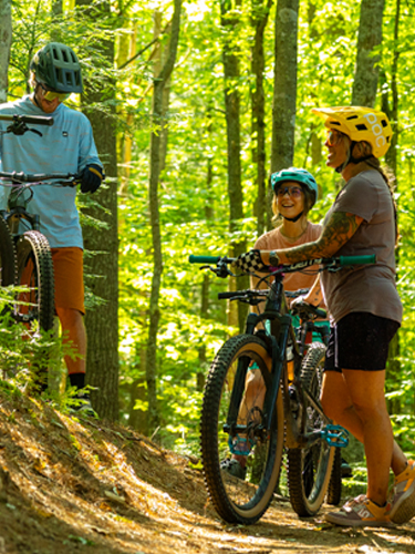 mountain bikers gathering on the trail at bear brook state park