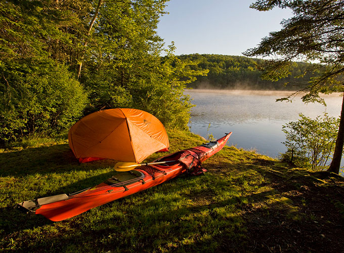 Tent at campsite near water