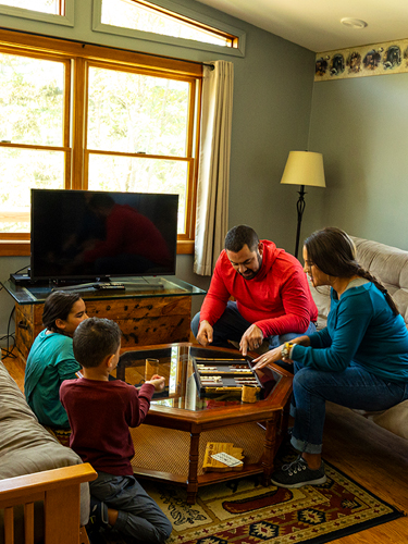 coleman lodges family playing boardgame