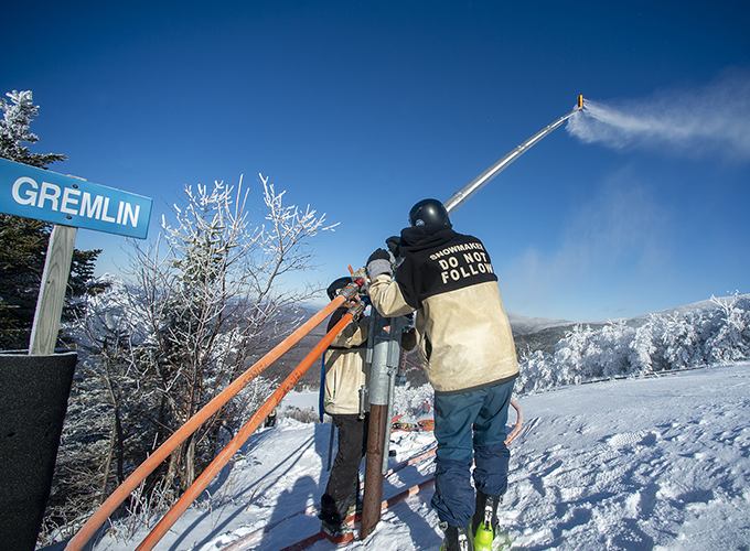 snowmakers at cannon mountain blue sky
