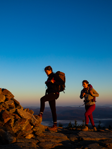 two young women hiking at rollins state park