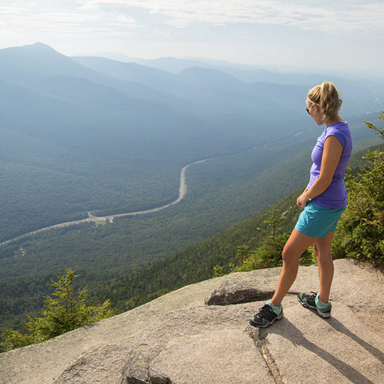 woman hiking at franconia notch