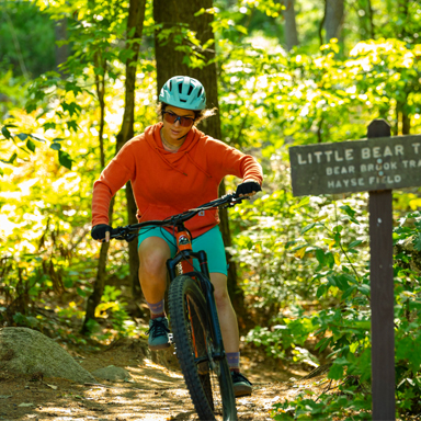 woman mt biking at bear brook state park