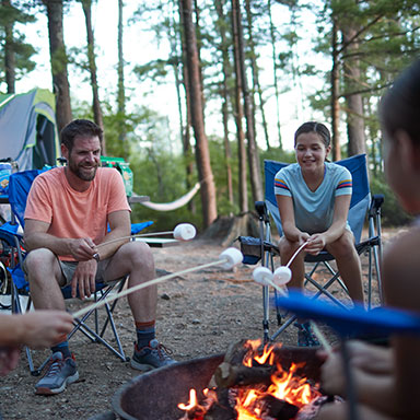 A family camping at night