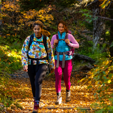 two young women fall hiking - fall foliage
