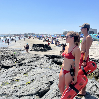 man and woman lifeguard on watch at wallis sands