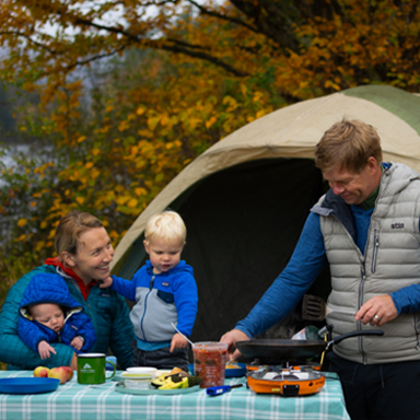 A family camping at night