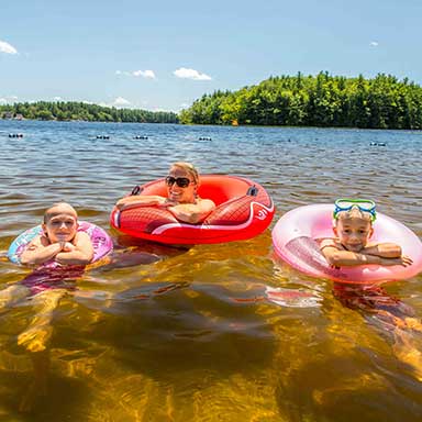 Family in tubes on a lake