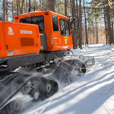 A snowplow plowing a trail