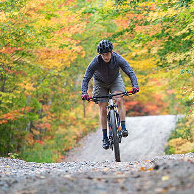 A man biking through a trail