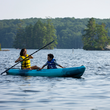 woman and boy kayaking at pawtuckaway state park