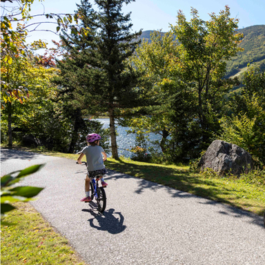 child riding a bike on presidential rail trail