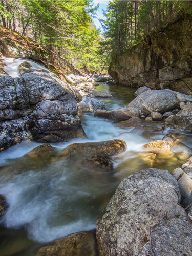 sculptured rocks waterfall in spring