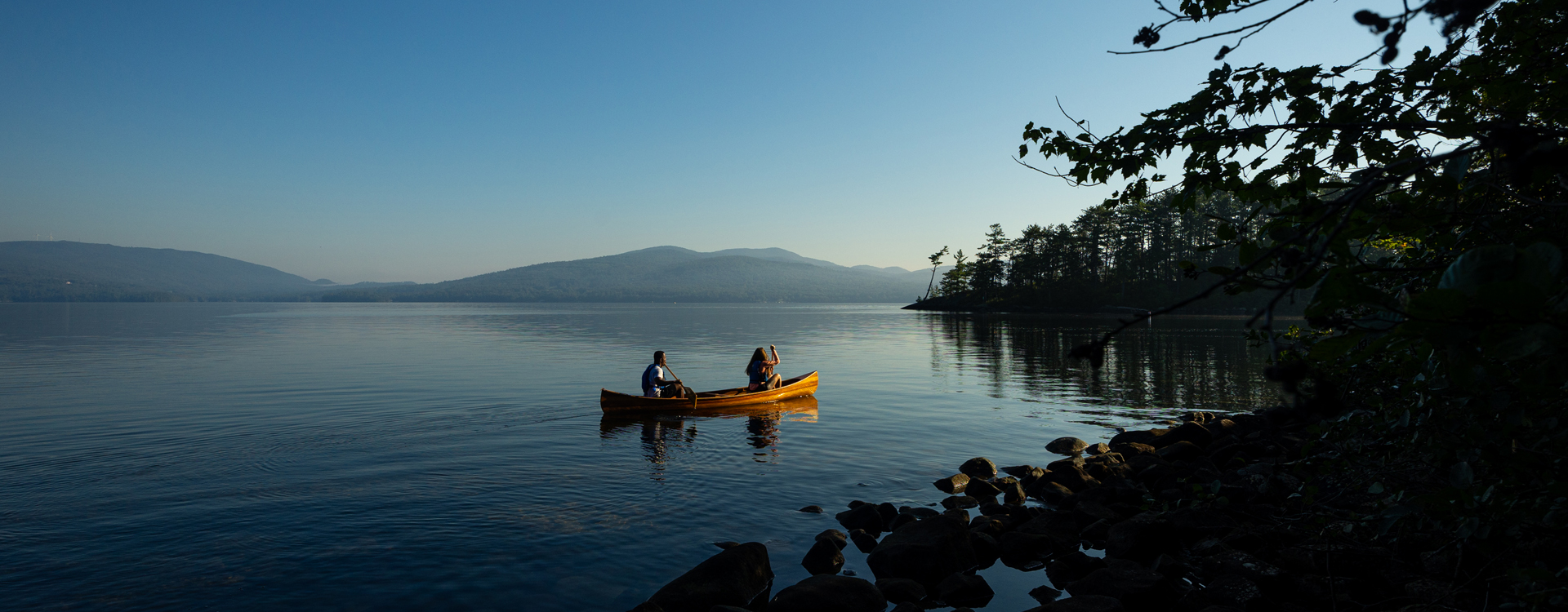 couple canoeing on new found lake - wellington state park
