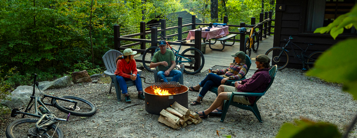 mountain bikers at bear  hill cabins campfire