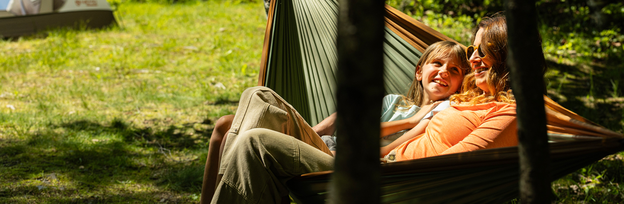 mother and daughter in hammock at campsite at jericho mountain state parks 