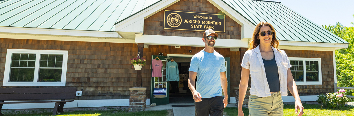 Couple walking in front of jericho mountain state park office and store