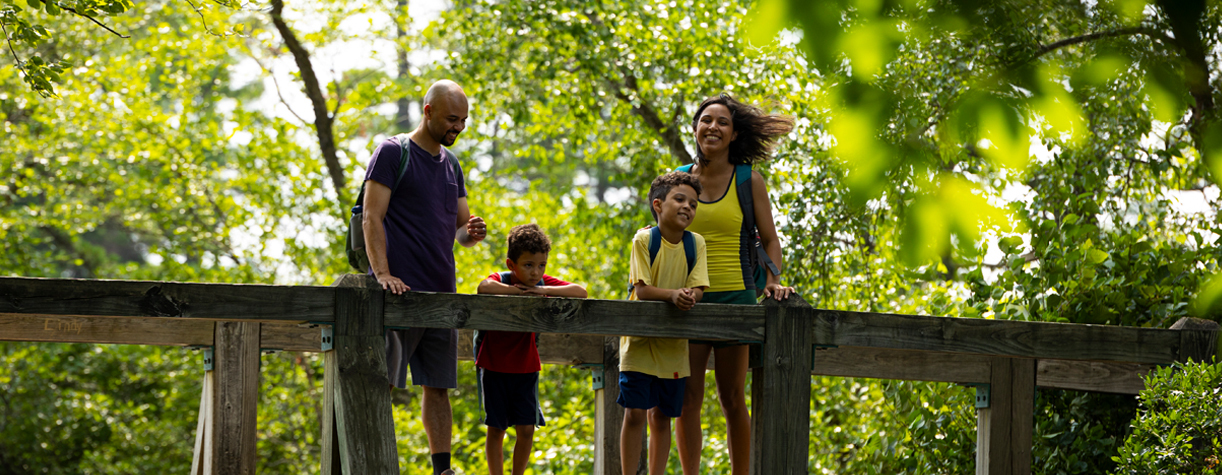 family on bridge at pawtuckaway state park