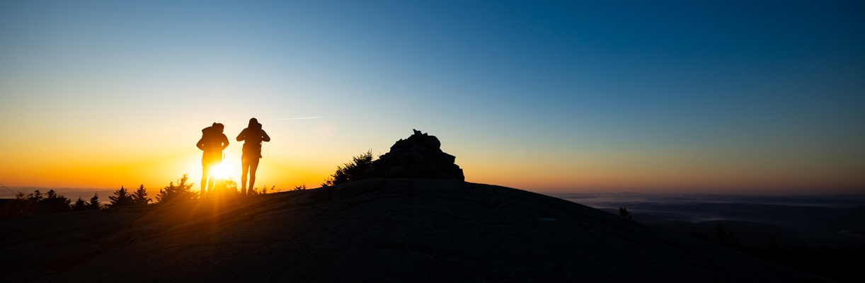 two women hikers at sunrise rollins state park