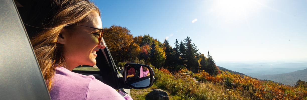 woman looking out car window on rollins state park auto road.