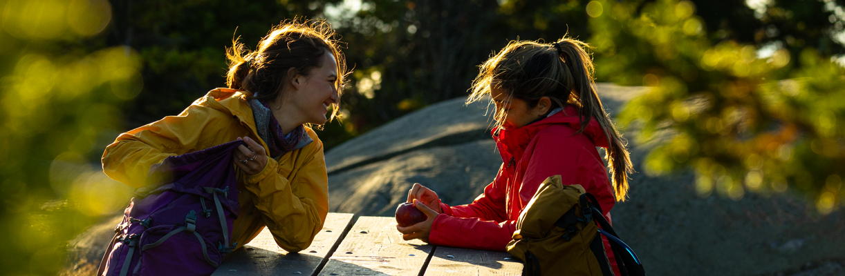 two women hikers at picnic table rollins state park