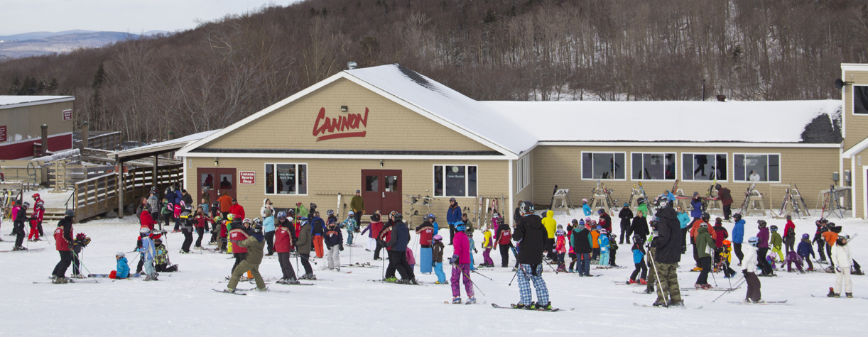 cannon mountain ski lodge with kids taking a lesson