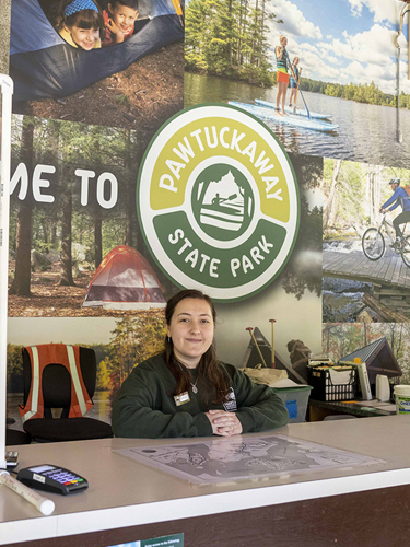 park employee at reception desk at Pawtuckaway