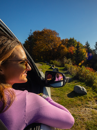 woman hiker riding in car to rollins state park