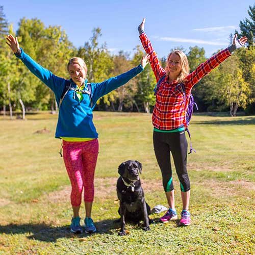 Hikers with a dog at Moose Brook