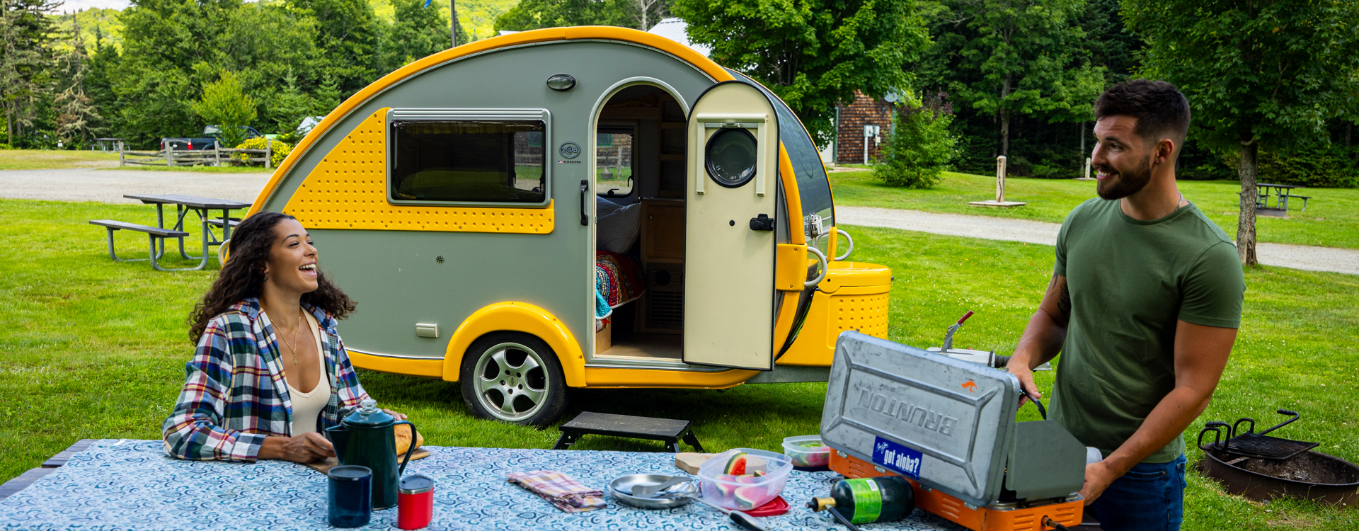 young couple with teardrop camper at coleman state Park