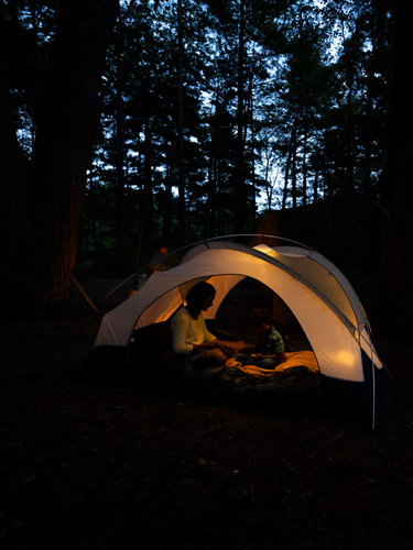 mother and son in tent at night pawtuckaway state park