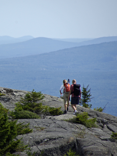 two hikers on the summit of mt monadnock