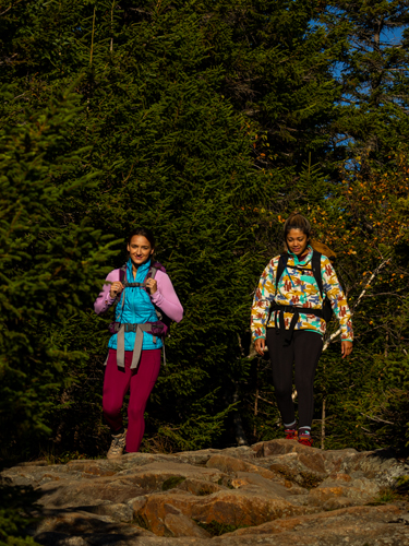 two young women hiking at rollins state park