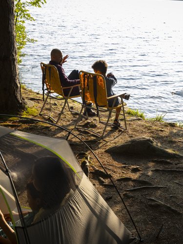 young man kayaking at pawtuckaway state park in autumn