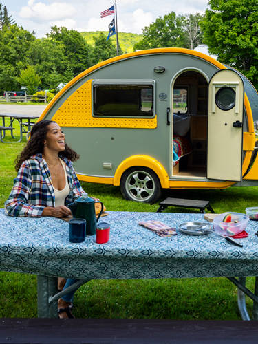 young couple with teardrop camper at coleman state Park