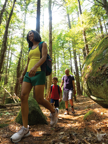 young family hiking at pawtuckaway state park