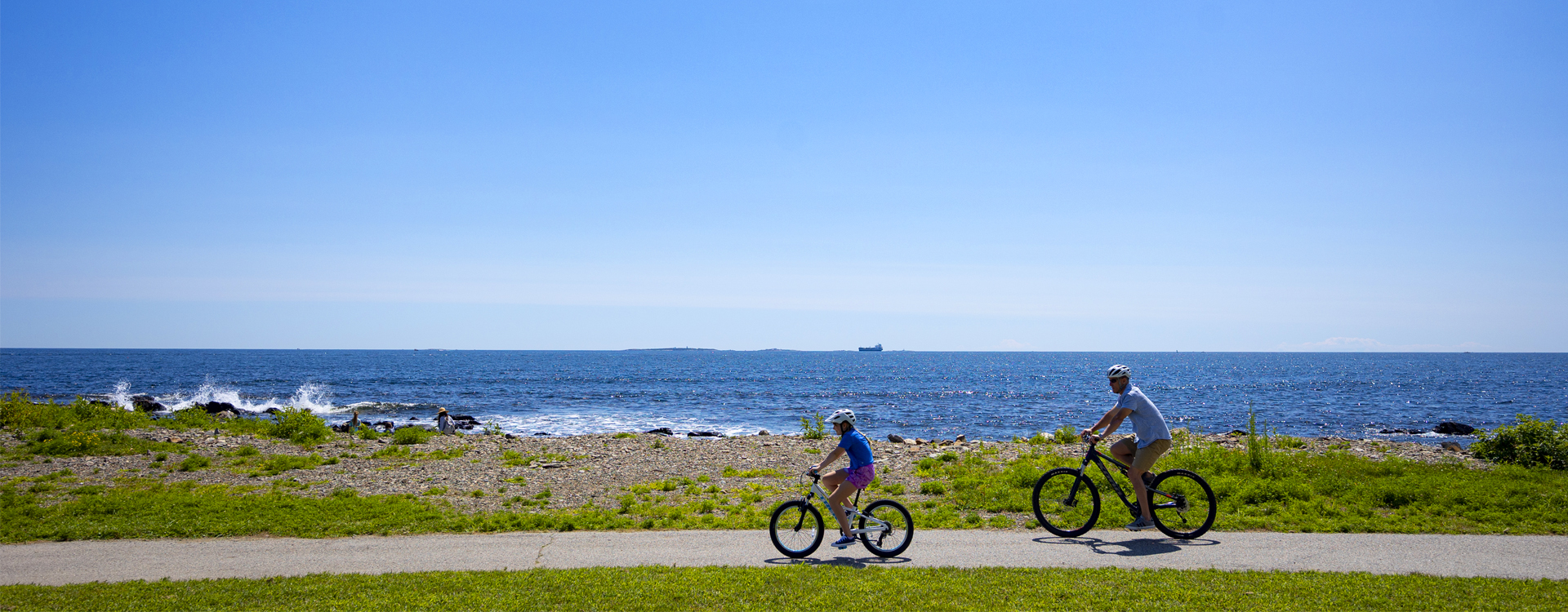 father and son bicycling at odiorne state park