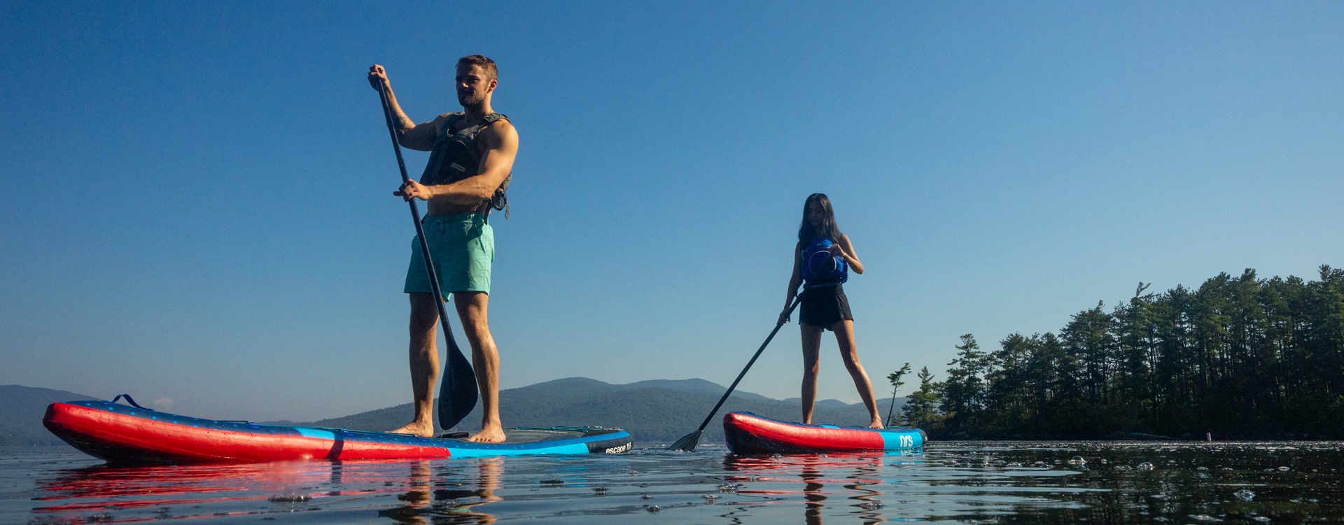 man and woman paddleboarding at wellington state park