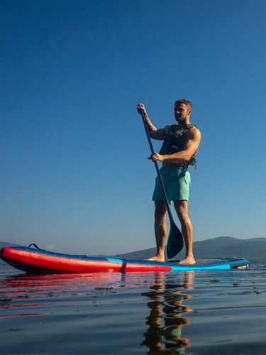man and woman paddleboarding at wellington state park