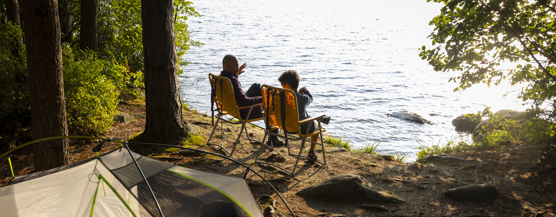 young man kayaking at pawtuckaway state park in autumn