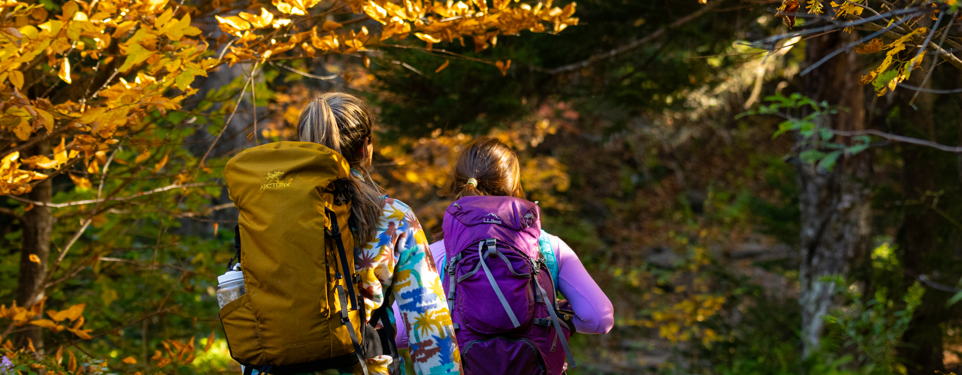 two young women fall hiking - fall foliage