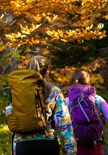 two young women fall hiking - fall foliage