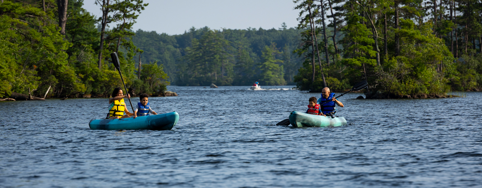family kayaking at pawtuckaway state park