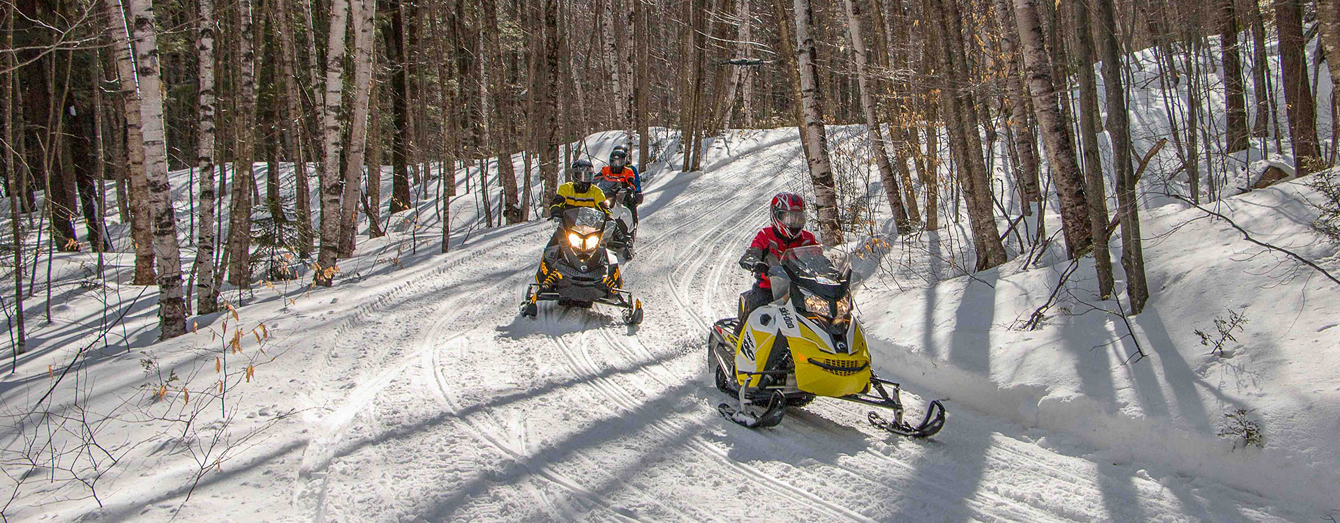snowmobiles on a snowy track