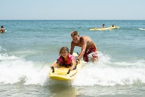 lifeguard with girl on a float