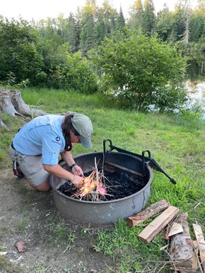 sca ranger building a fire in fire ring