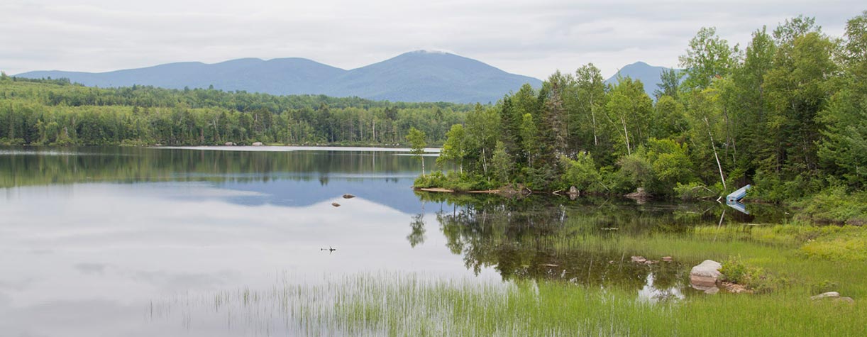Lake with mountains in background